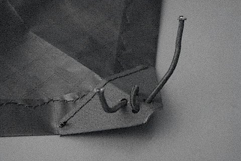 Bungi through 4 holes of the Dacron nose